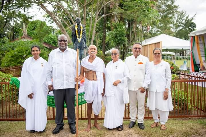 Left to Rt Sis Kinnari, Prime Minister of Guyana Hon. Brigadier (Ret’d) Mark Anthony Phillips, M.S.S., Uncle Leo as Mahatma Gandhi, Sis Nandi, High Commissioner of India to Guyana Dr. K. J. Srinivasa and Sis Saroj